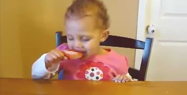 Too tired for a treat! Watch this baby battle sleep to finish her ice-pop Too tired for a treat! Watch this baby battle sleep to finish her ice-pop