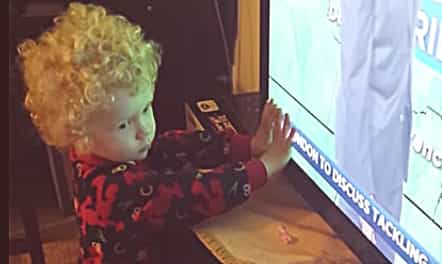 WATCH: Confused toddler tries to stop the words from ‘leaving’ the TV