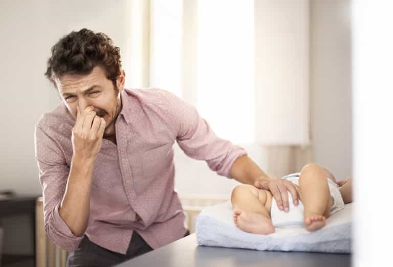 The 5 stages of wrestling a squirming child into a nappy The 5 stages of wrestling a squirming child into a nappy