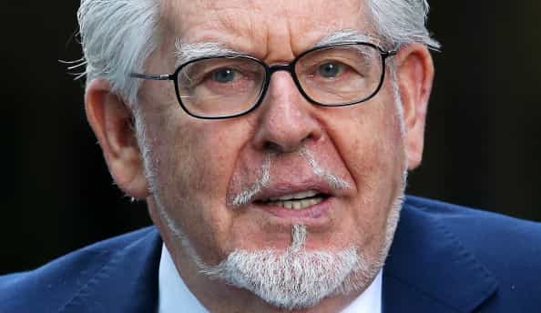 Rolf Harris reported to police after being removed from grounds of primary school