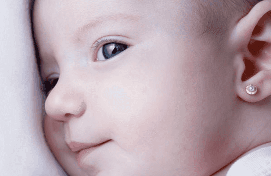 Dad’s warning after piercing gun gets stuck on baby’s ear causing ‘damage’