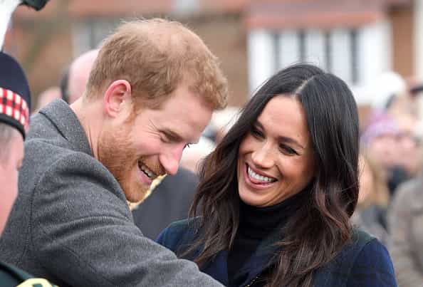 Meghan and Harry wore pretty much the same outfit last night and they looked great