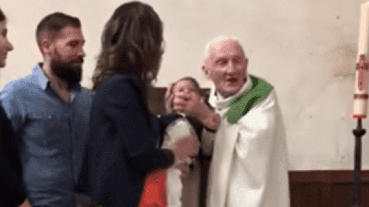 Priest who was seen slapping a crying baby has tried to explain his actions