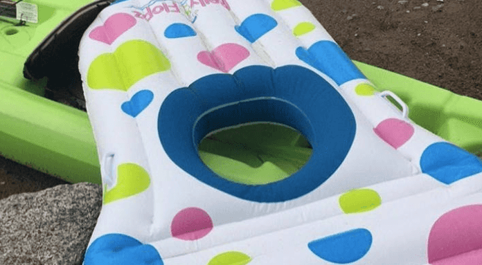 A pool float with a hole for your pregnant belly exists and FINALLY
