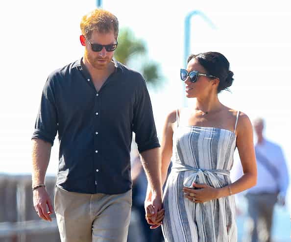 Why Meghan can’t keep her hands off her baby bump, according to a midwife