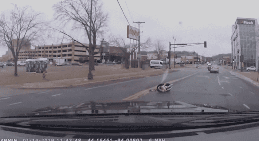 Terrifying footage shows car seat with two-year-old fall out of moving car on busy street