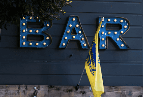 Two crafty families create a ‘social distance’ bar between their two gardens – and it is the best