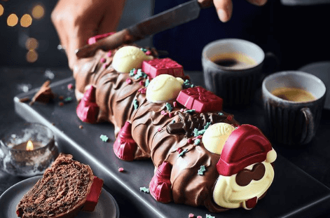 M&S festive offerings: Christmas Colin the Caterpillar and Percy Pig cake M&S festive offerings: Christmas Colin the Caterpillar and Percy Pig cake