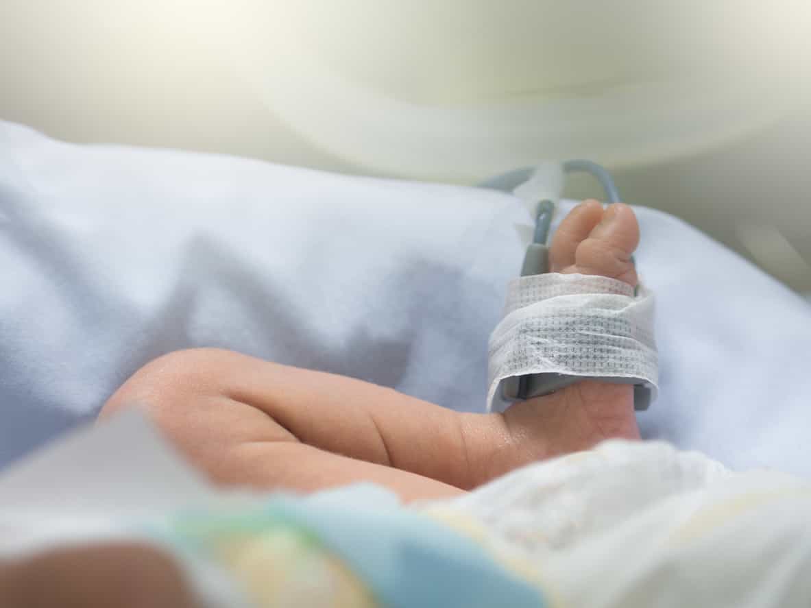 Formerly conjoined twin gives birth at hospital where she was separated from her sister