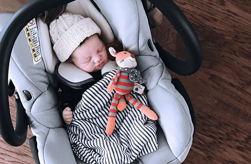 Turns out, we have all been carrying baby car seats the completely wrong way