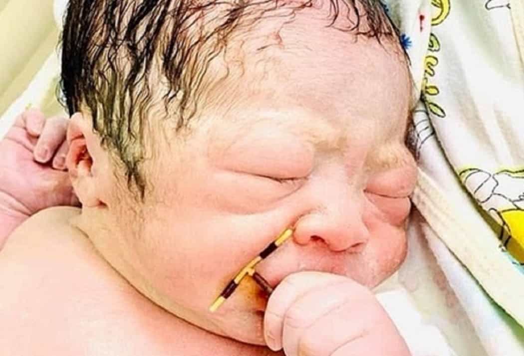 Baby pictured holding mum’s failed IUD after ‘miracle’ pregnancy