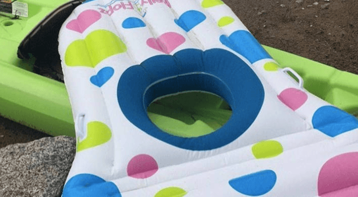 A pool float with a hole for your pregnant belly exists and FINALLY