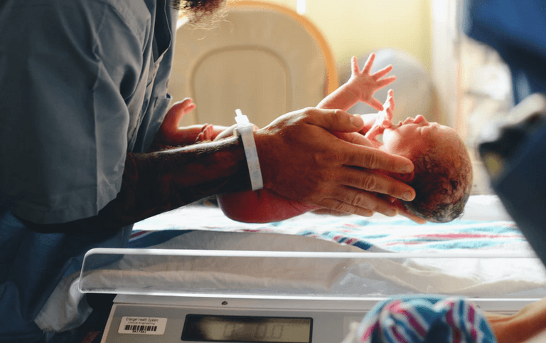 Dad-to-be slammed online for sharing snap of himself eating pizza in the delivery room