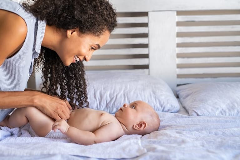 Expert claims parents should stop lifting baby’s legs when changing their nappy