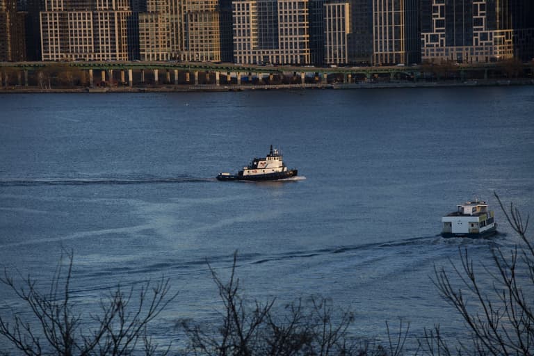 Woman and child killed as boat capsizes in New York Woman and child killed as boat capsizes in New York