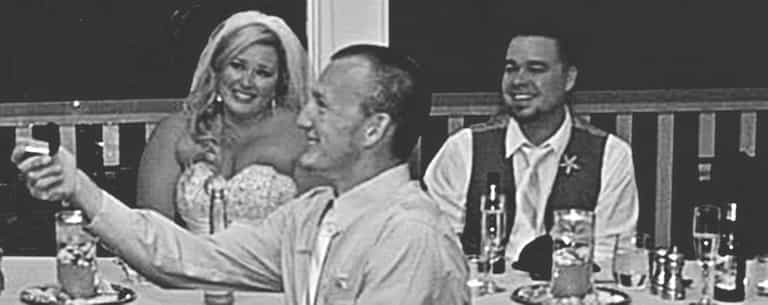 One of the men in this wedding photo is making a HUGE mistake. One of the men in this wedding photo is making a HUGE mistake.