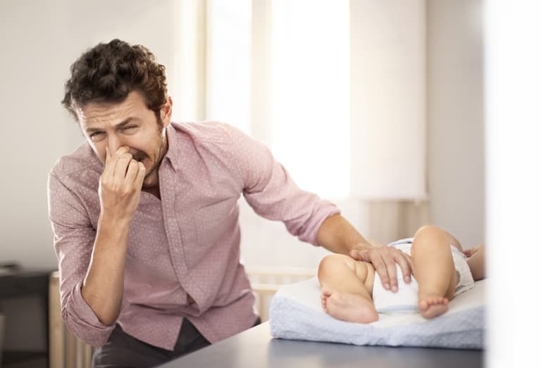 The 5 stages of wrestling a squirming child into a nappy The 5 stages of wrestling a squirming child into a nappy