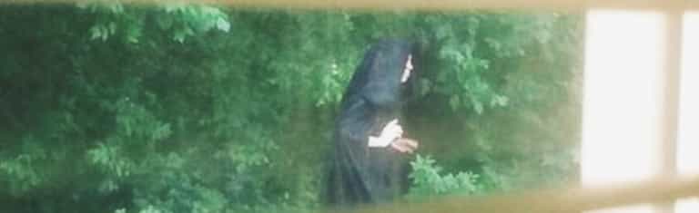 This mystery cloaked playground figure is making locals VERY uncomfortable This mystery cloaked playground figure is making locals VERY uncomfortable