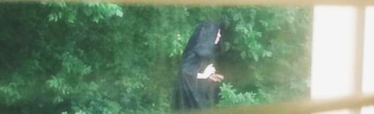 This mystery cloaked playground figure is making locals VERY uncomfortable This mystery cloaked playground figure is making locals VERY uncomfortable