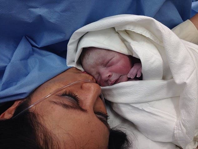 Update: Couple are reunited with their swapped newborn son Update: Couple are reunited with their swapped newborn son