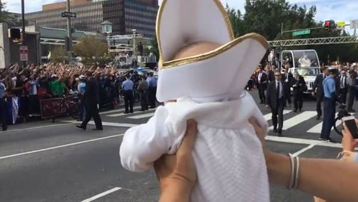 WATCH: Pope Francis cracks up when he sees a baby dressed just like him WATCH: Pope Francis cracks up when he sees a baby dressed just like him
