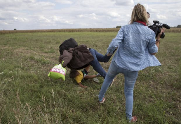 Shocking video shows camerawoman TRIP a refugee dad Shocking video shows camerawoman TRIP a refugee dad