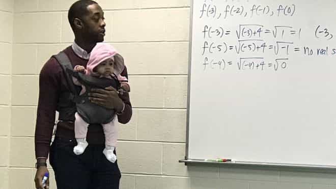 Professor carries student’s baby during lecture so young dad can take notes Professor carries student’s baby during lecture so young dad can take notes