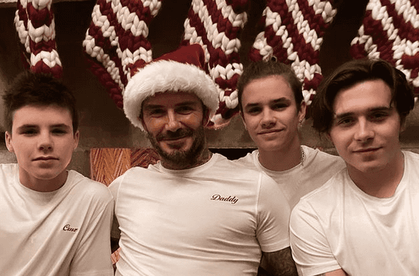 Victoria Beckham is every mum trying to get the kids to pose for a Christmas card photo Victoria Beckham is every mum trying to get the kids to pose for a Christmas card photo