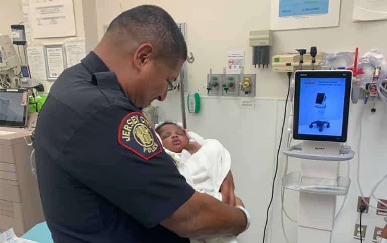 Police officer makes incredible catch after baby is thrown from balcony Police officer makes incredible catch after baby is thrown from balcony