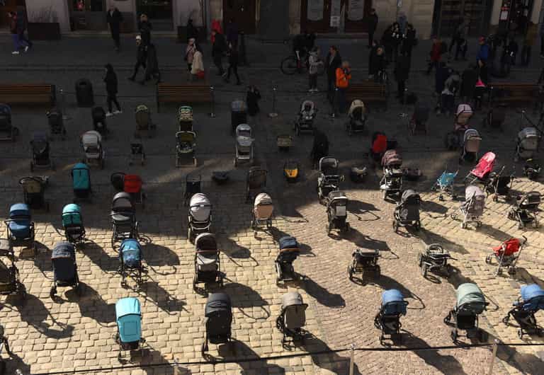 109 strollers left empty in Ukraine in memory of children killed 109 strollers left empty in Ukraine in memory of children killed