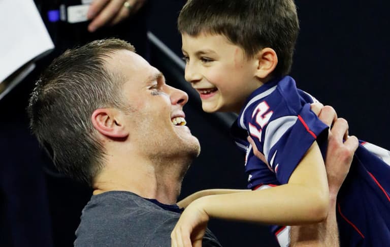 American footballer faces criticism for kissing 11-year-old son on the lips American footballer faces criticism for kissing 11-year-old son on the lips