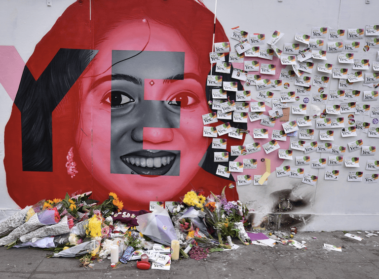 People are leaving flowers, tributes and messages at the mural of Savita in Dublin People are leaving flowers, tributes and messages at the mural of Savita in Dublin